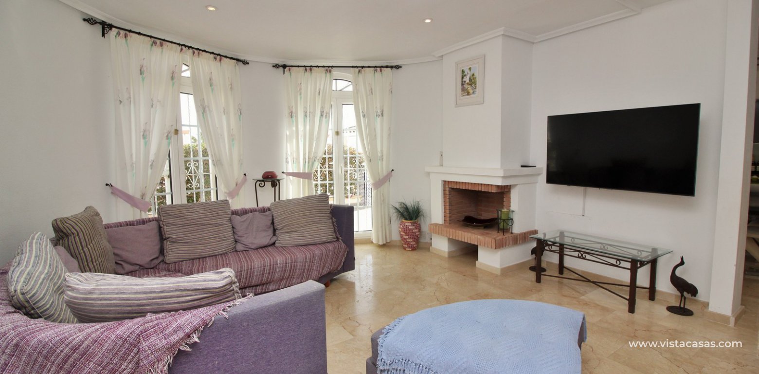 Villa with private pool for sale R3 Las Violetas Villamartin lounge fireplace