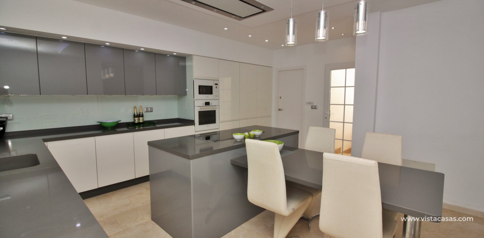 Villa with private pool for sale R3 Las Violetas Villamartin modern open kitchen