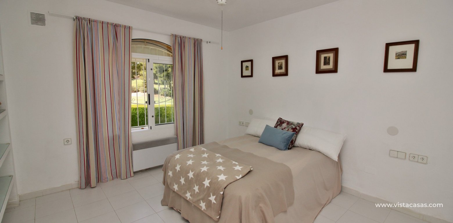 Detached villa for sale overlooking the golf course Fortuna II Villamartin master bedroom golf views