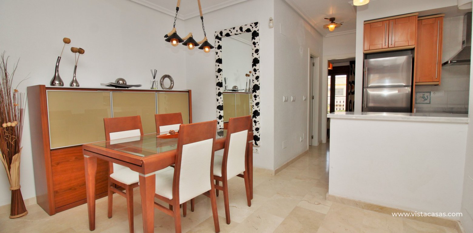 Top floor apartment overlooking the pool for sale M3 Pau 8 Villamartin dining area