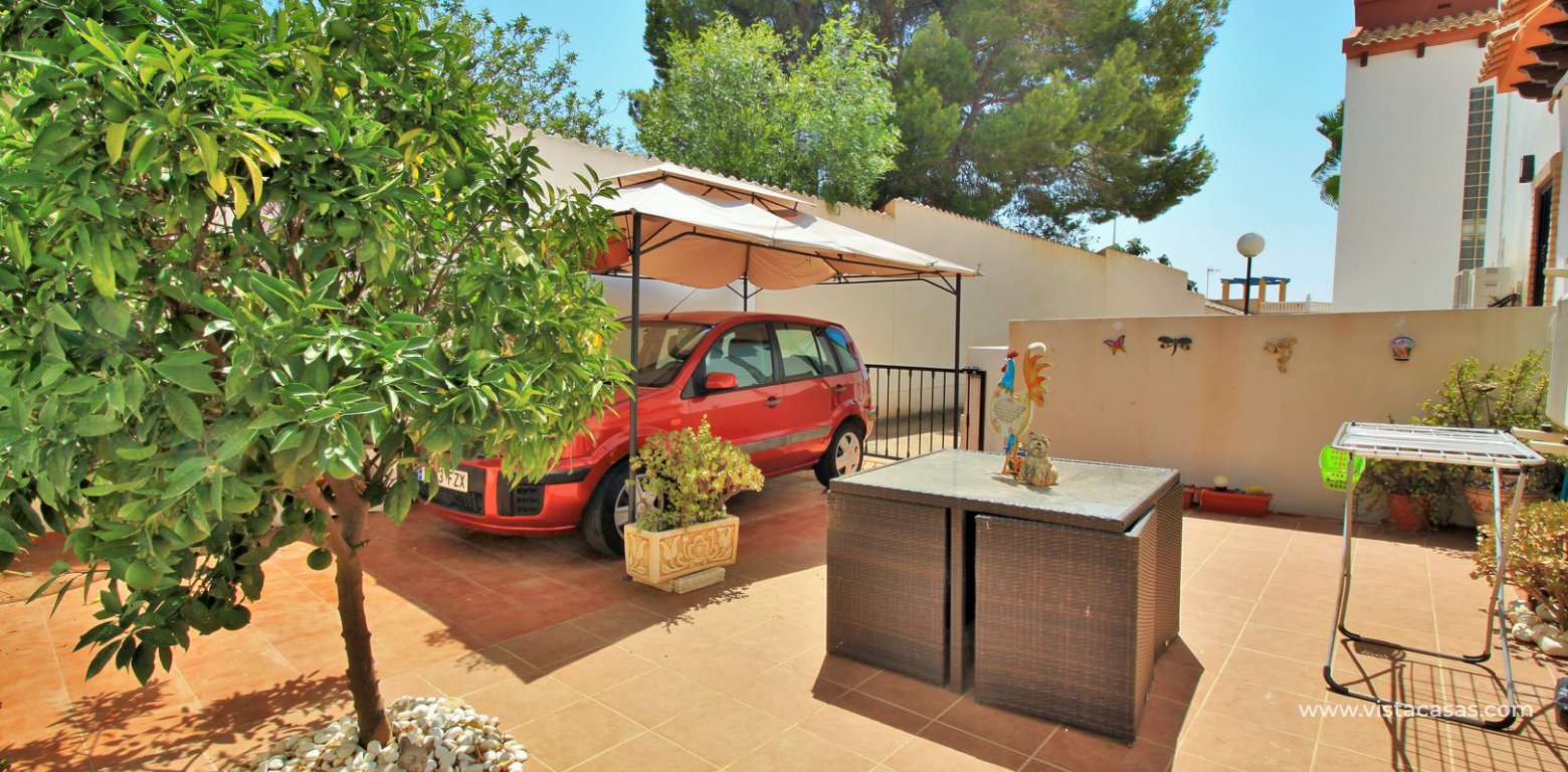 3 bedroom villa for sale overlooking the pool El Palmeral Pau 8 Villamartin carport
