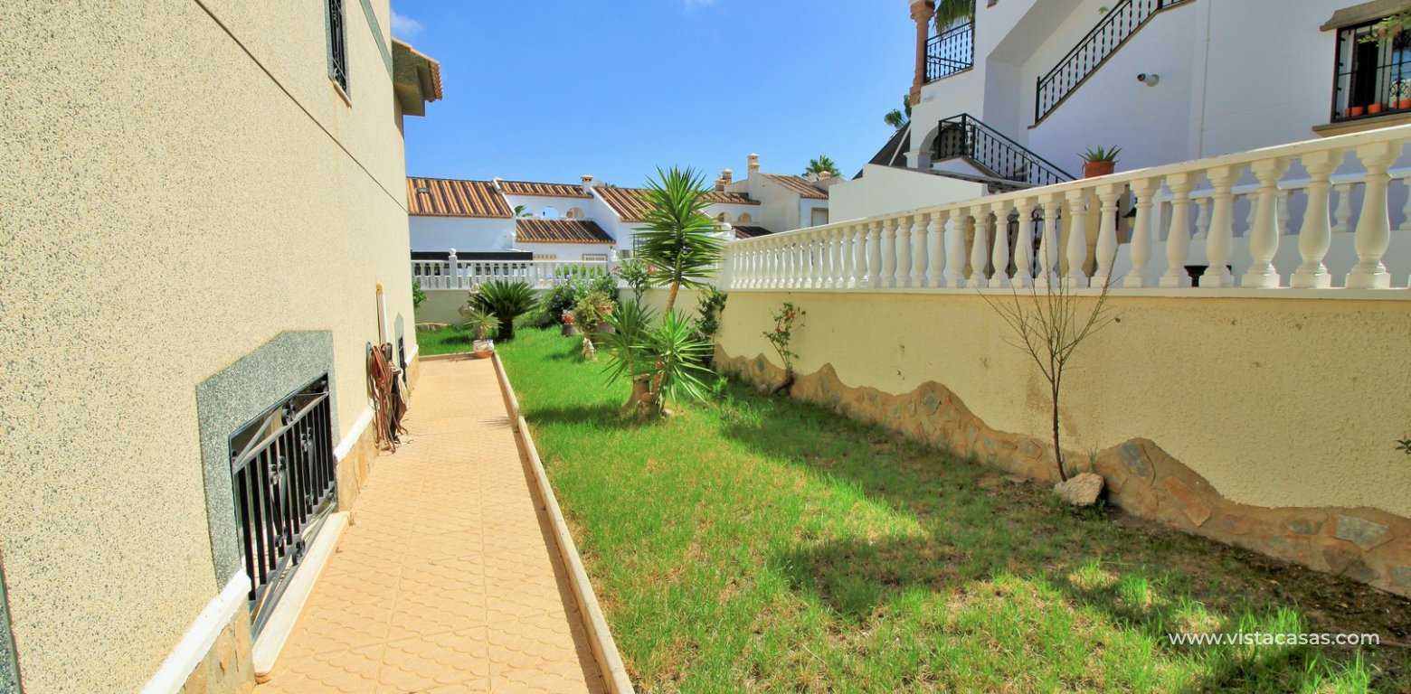 Detached villa for sale Las Violetas Villamartin side garden