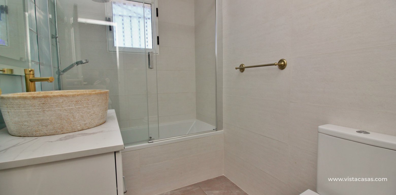 Quad house private pool for sale Lago Sol Los Altos renovated bathroom