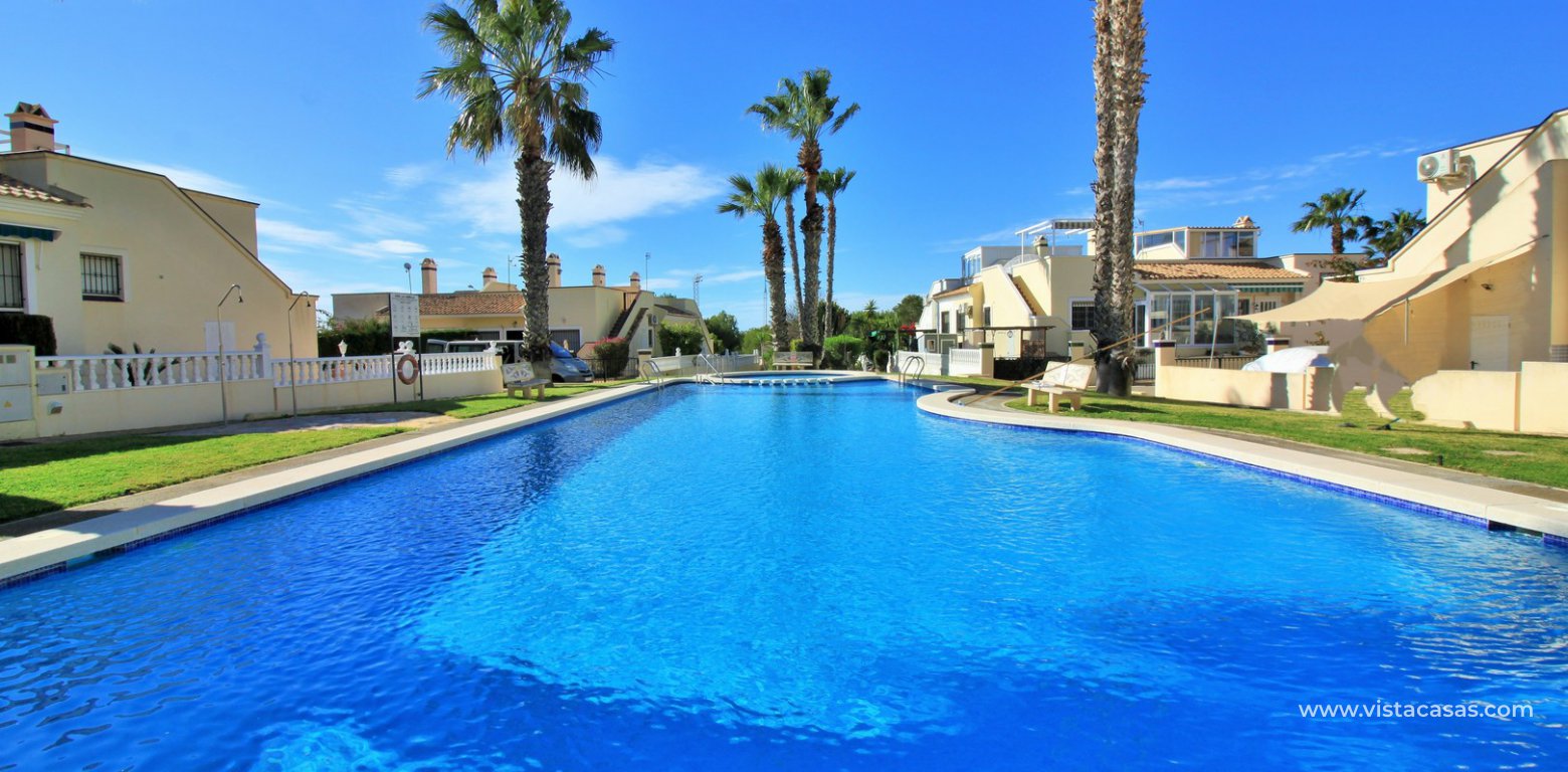 South facing Jumilla bungalow for sale Playa Flamenca swimming pool
