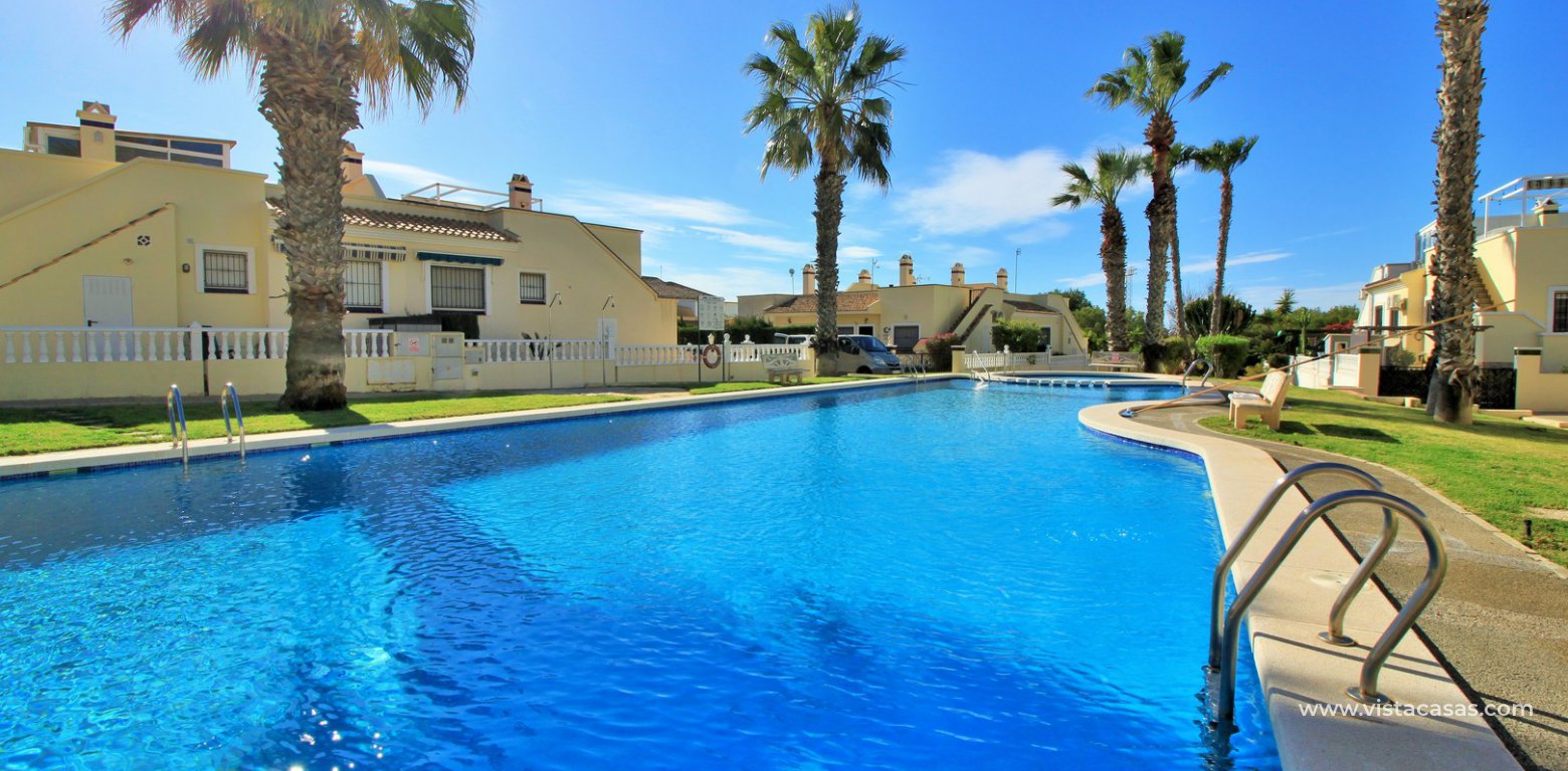 South facing Jumilla bungalow for sale Playa Flamenca communal swimming pool