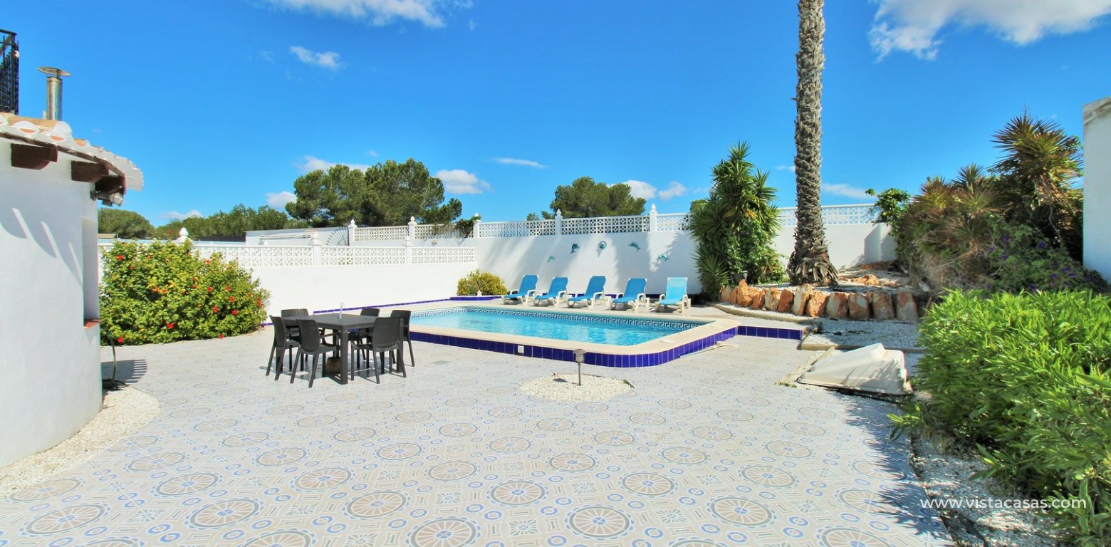 Villa with private pool for sale Villamartin Golf rear terrace pool area
