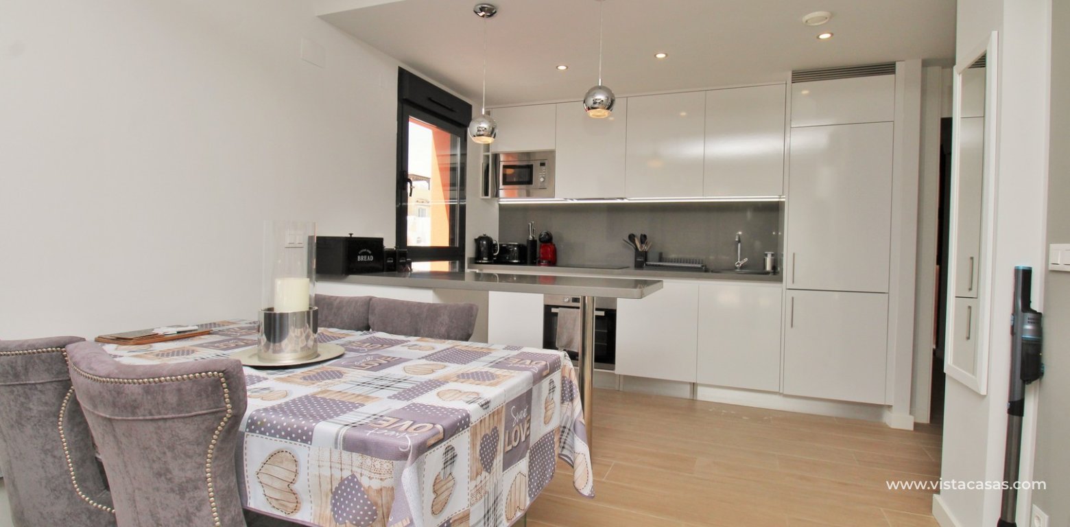 Modern 2 Bed Apartment For Sale in Palapa Golf Villamartin dining area