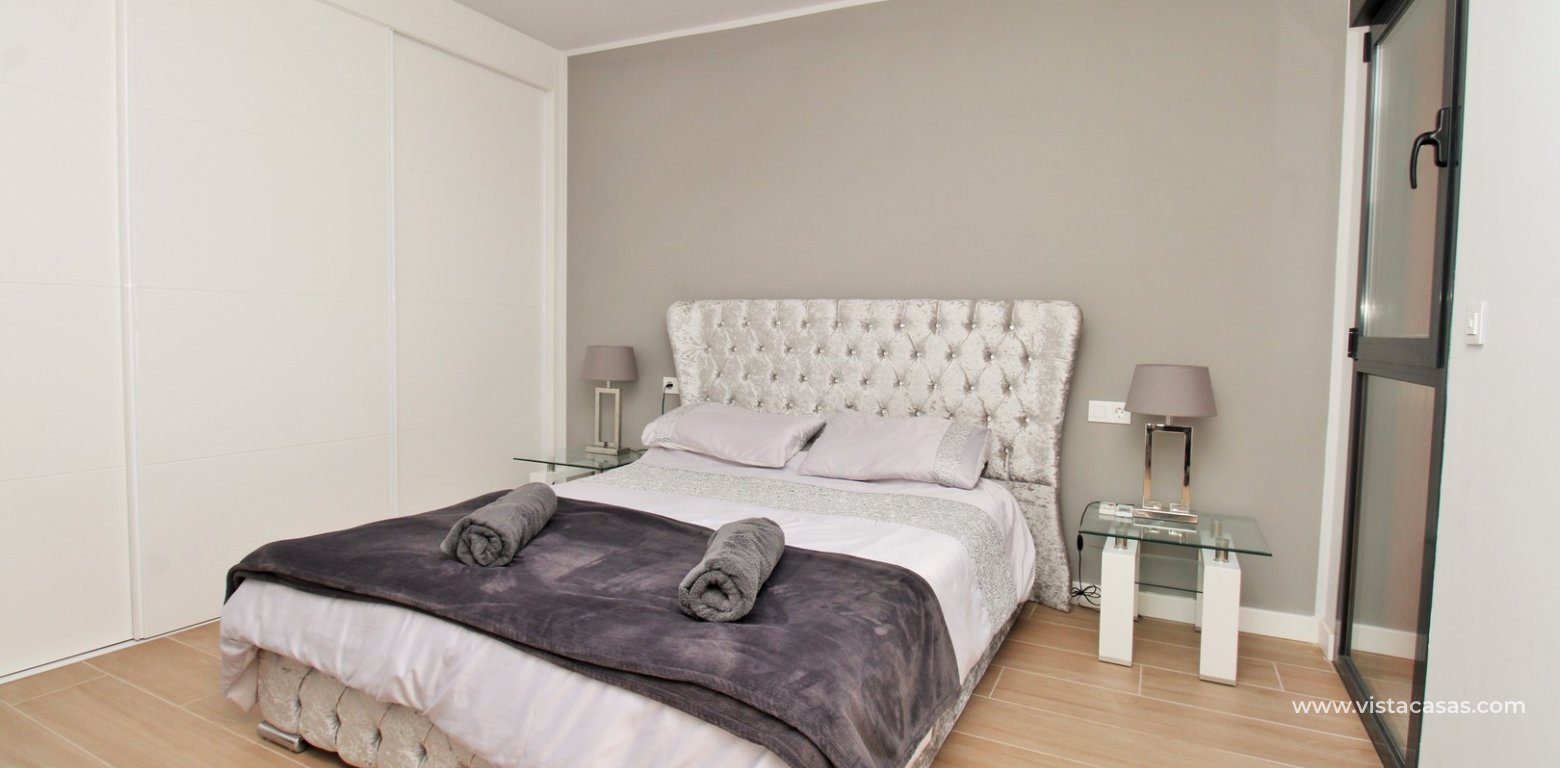 Modern 2 Bed Apartment For Sale in Palapa Golf Villamartin master bedroom