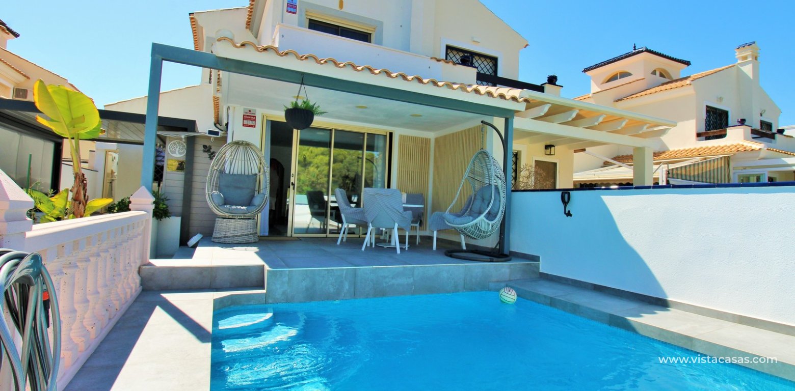 Beachside semi-detached house for sale in Mil Palmeras with private swimming pool front