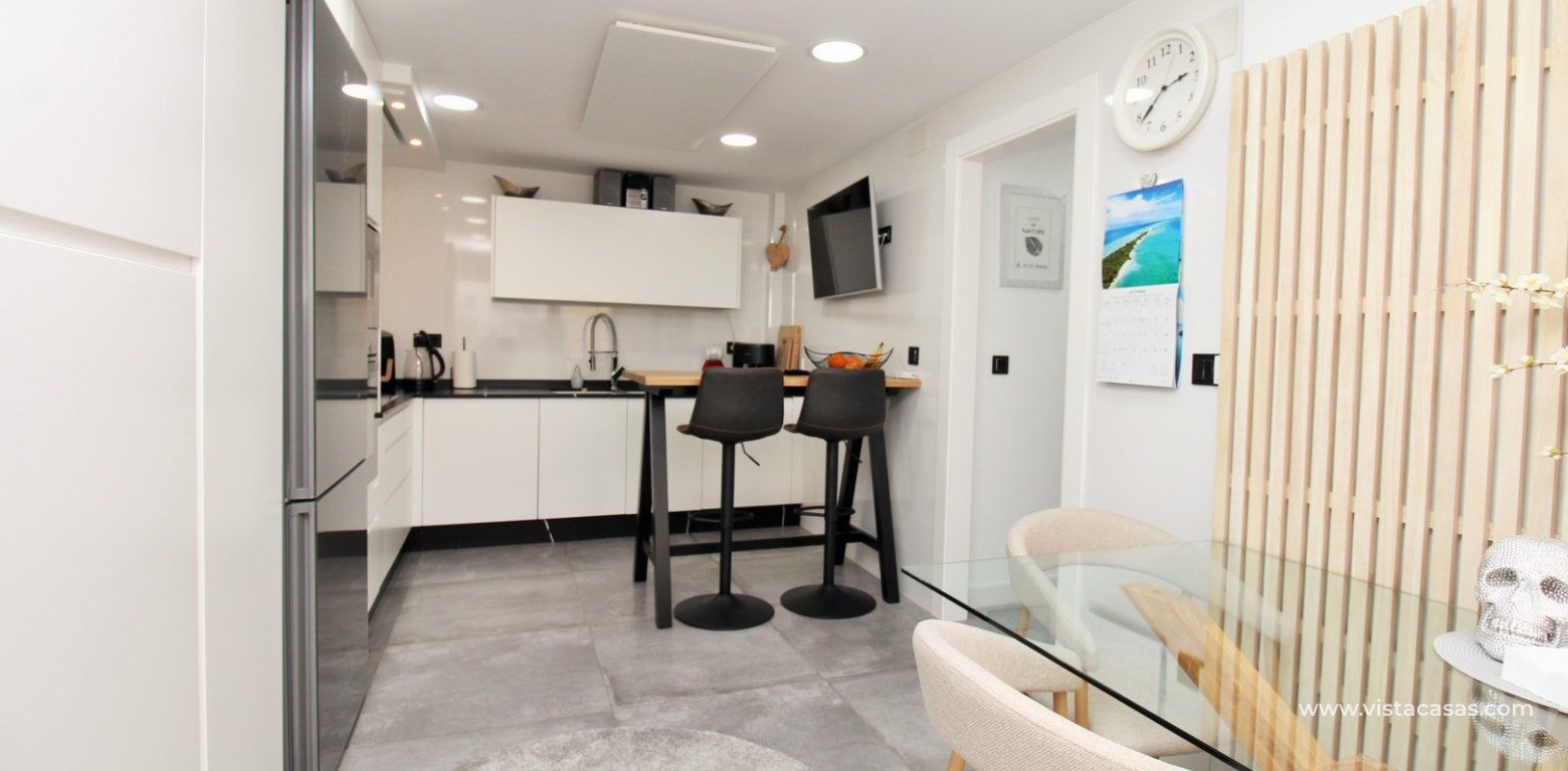Beachside semi-detached house for sale in Mil Palmeras with private swimming pool kitchen 3