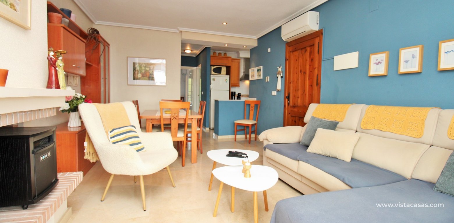 Top floor apartment with sea and pool views in for sale in Las Violetas Villamartin lounge
