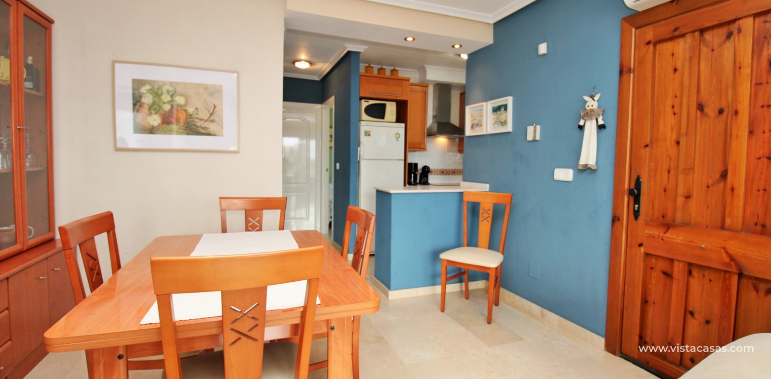 Top floor apartment with sea and pool views in for sale in Las Violetas Villamartin dining area
