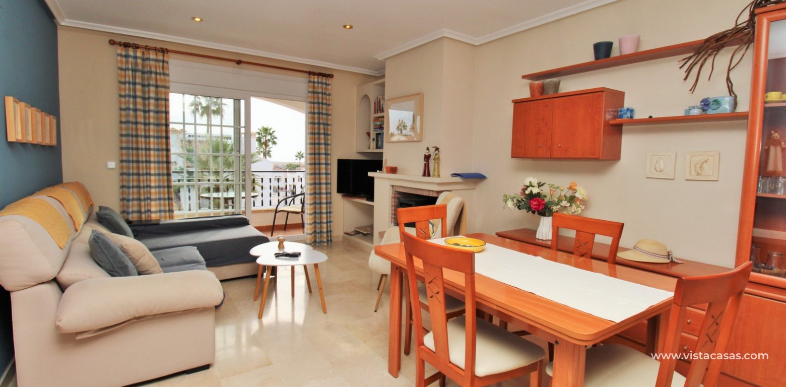 Top floor apartment with sea and pool views in for sale in Las Violetas Villamartin lounge diner