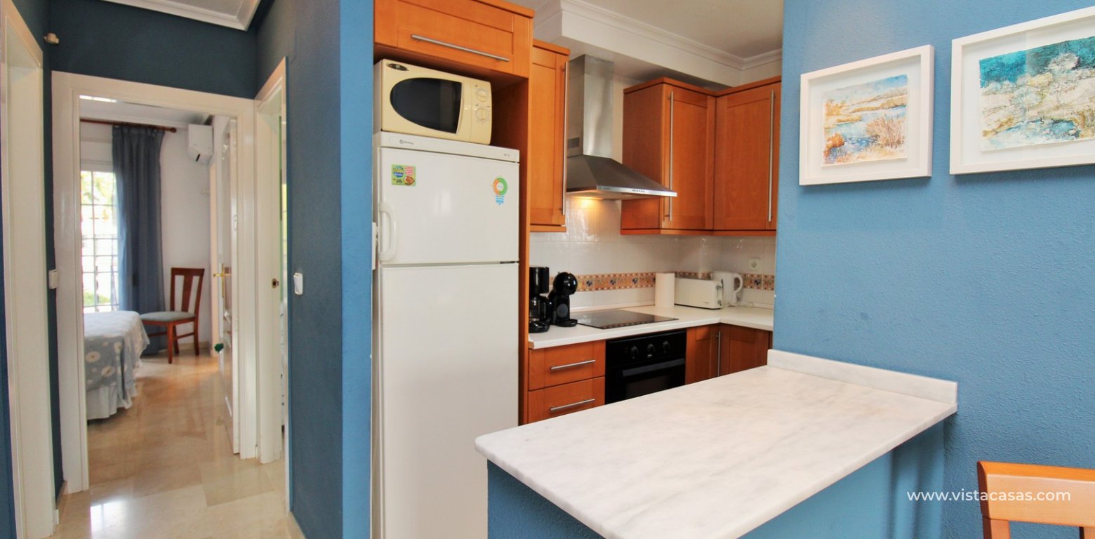 Top floor apartment with sea and pool views in for sale in Las Violetas Villamartin kitchen