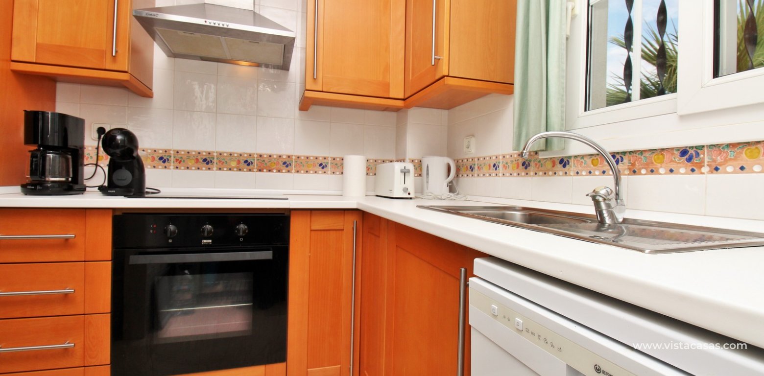 Top floor apartment with sea and pool views in for sale in Las Violetas Villamartin kitchen 4