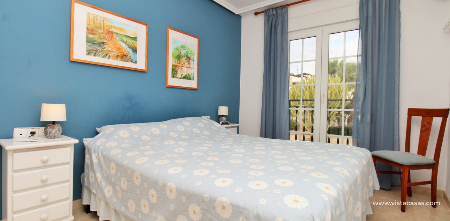 Top floor apartment with sea and pool views in for sale in Las Violetas Villamartin master bedroom