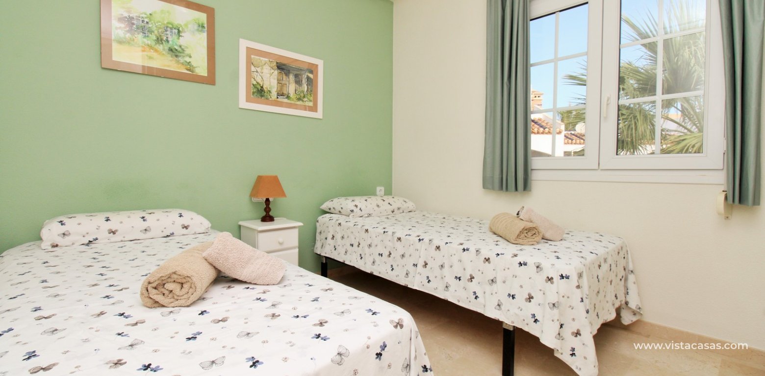 Top floor apartment with sea and pool views in for sale in Las Violetas Villamartin twin bedroom