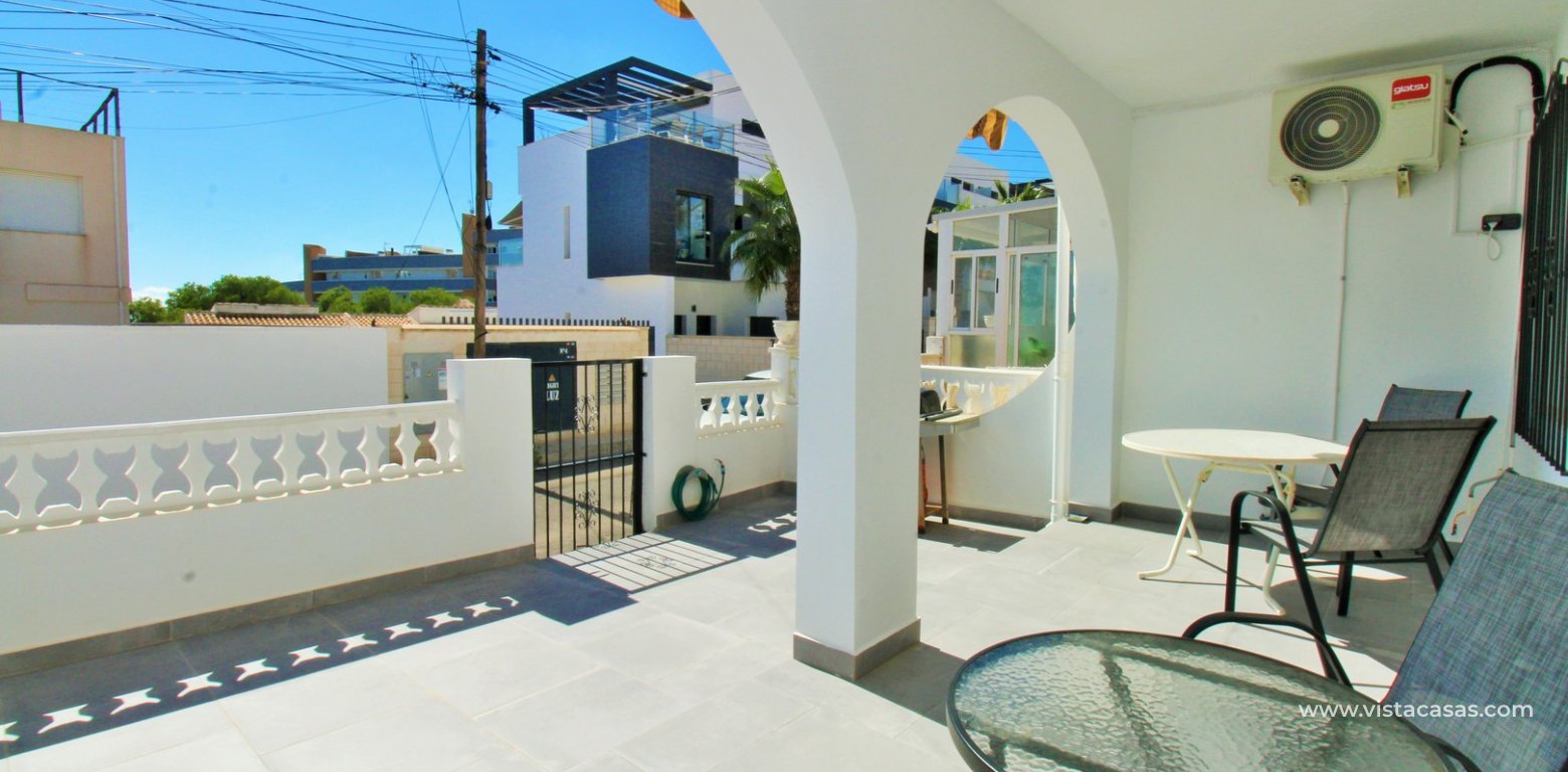 South-facing 2-bedroom bungalow for sale in Villamartin near La Fuente front porch