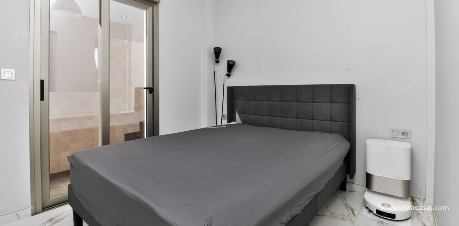 South-facing 4 bedroom villa for sale in Pink Paradise Villamartin guest bedroom