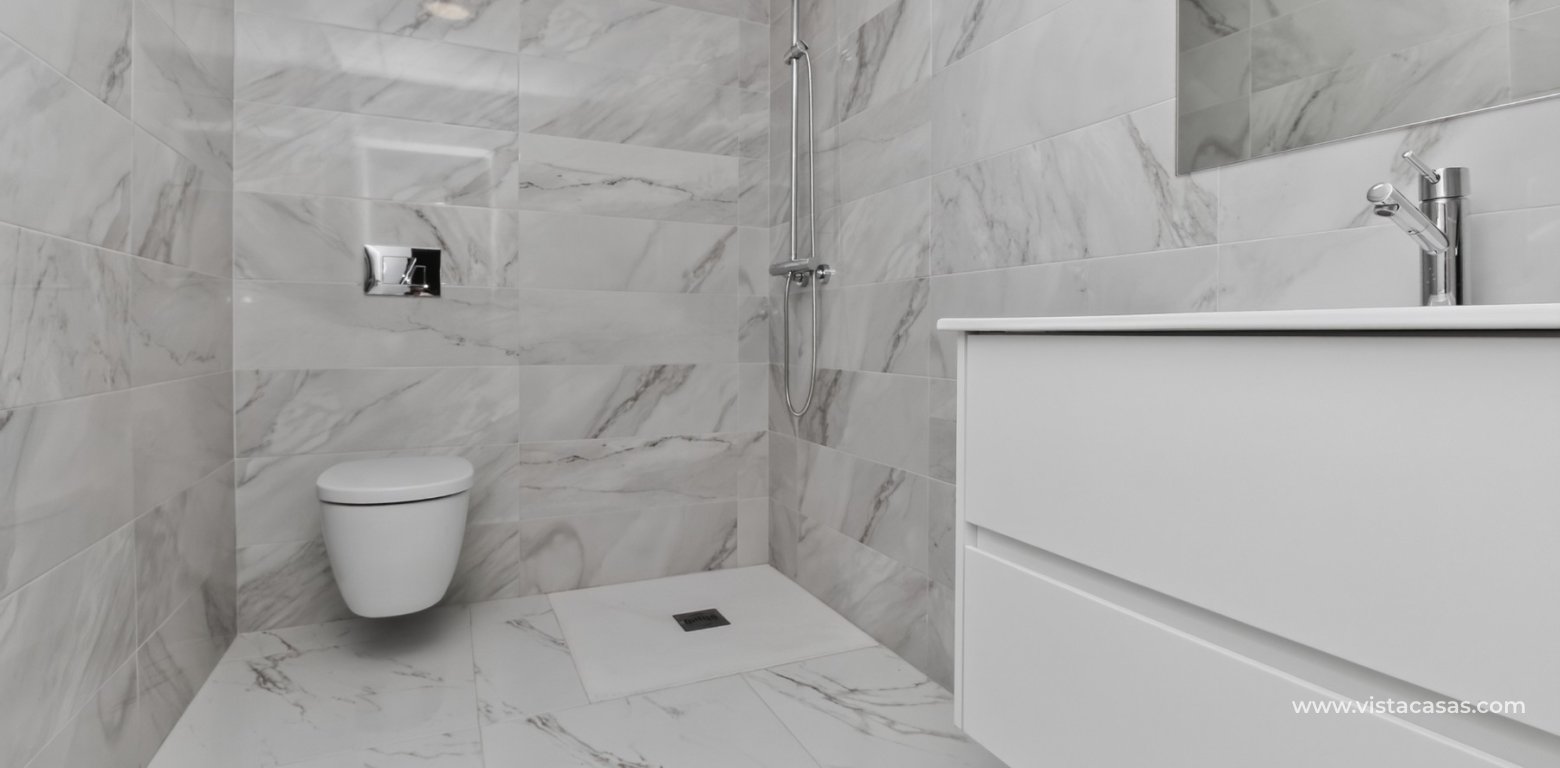 South-facing 4 bedroom villa for sale in Pink Paradise Villamartin underbuild bathroom