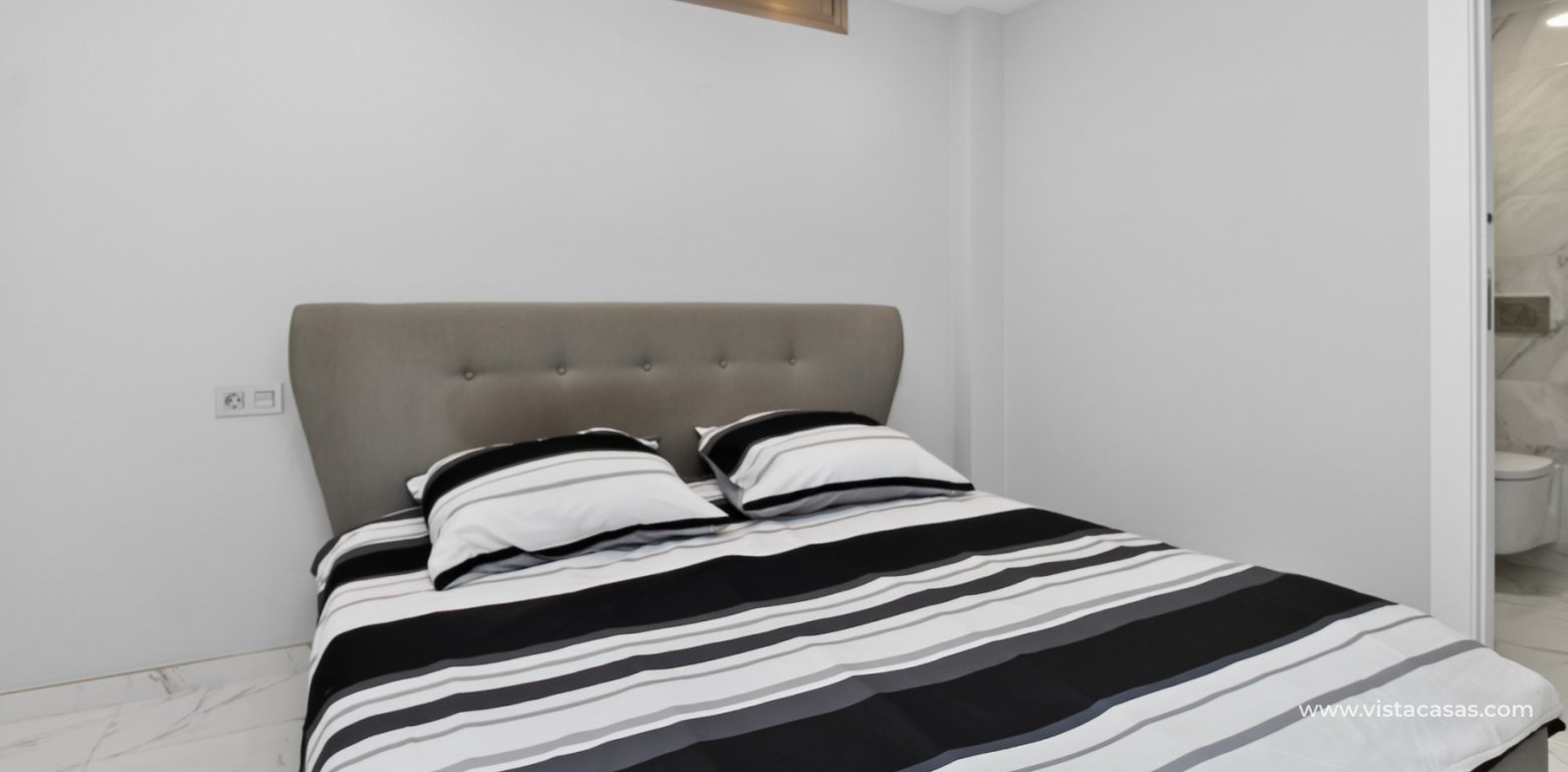 South-facing 4 bedroom villa for sale in Pink Paradise Villamartin underbuild master bedroom