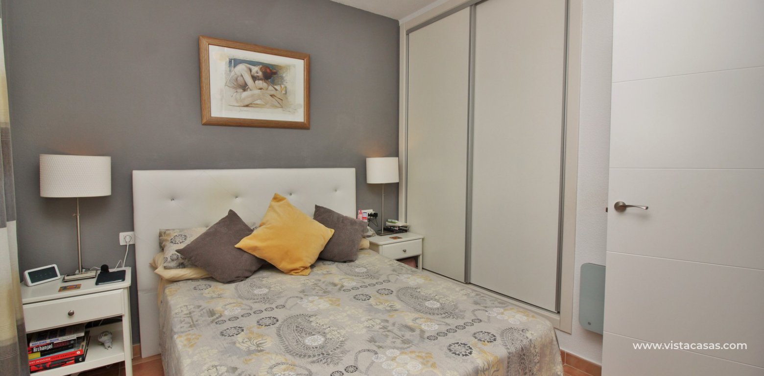 Modern top floor apartment for sale in Panorama Golf Villamartin master bedroom fitted wardrobes