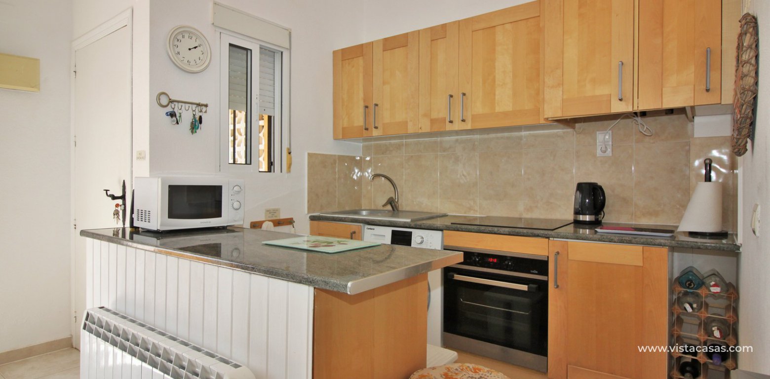 South facing apartment for sale Lomas del Golf Villamartin overlooking the pool kitchen