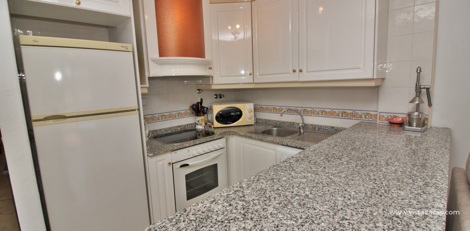 South facing apartment for sale Villamartin pool and golf views kitchen