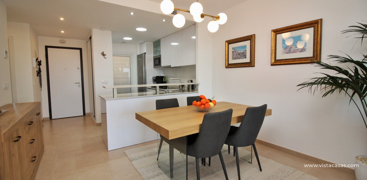South facing apartment overlooking the pool for sale in Residencial Gala Los Dolses Orihuela Costa dining area