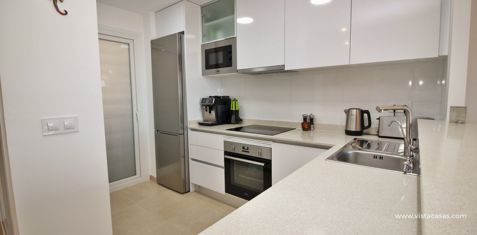 South facing apartment overlooking the pool for sale in Residencial Gala Los Dolses Orihuela Costa kitchen