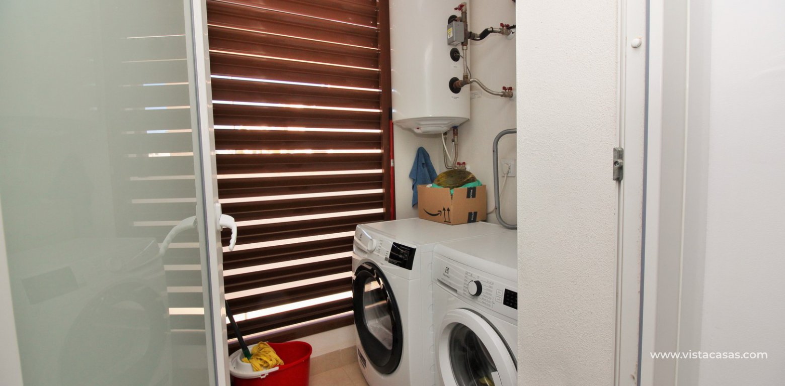 South facing apartment overlooking the pool for sale in Residencial Gala Los Dolses Orihuela Costa utility room