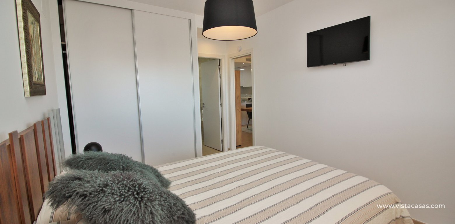 South facing apartment overlooking the pool for sale in Residencial Gala Los Dolses Orihuela Costa master bedroom fitted wardrobes