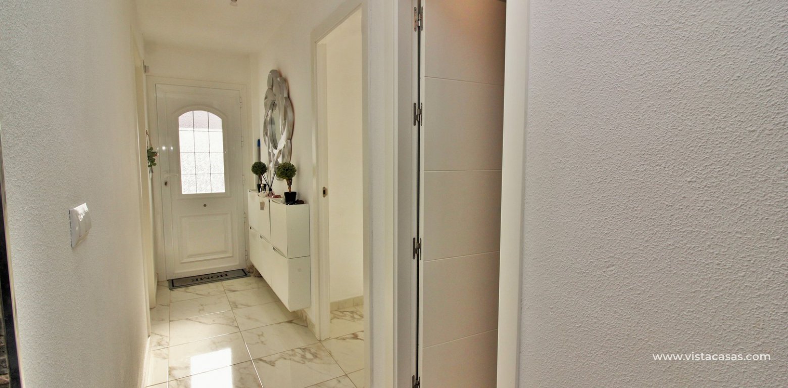 Renovated apartment overlooking the pool for sale in the Villamartin Plaza hallway
